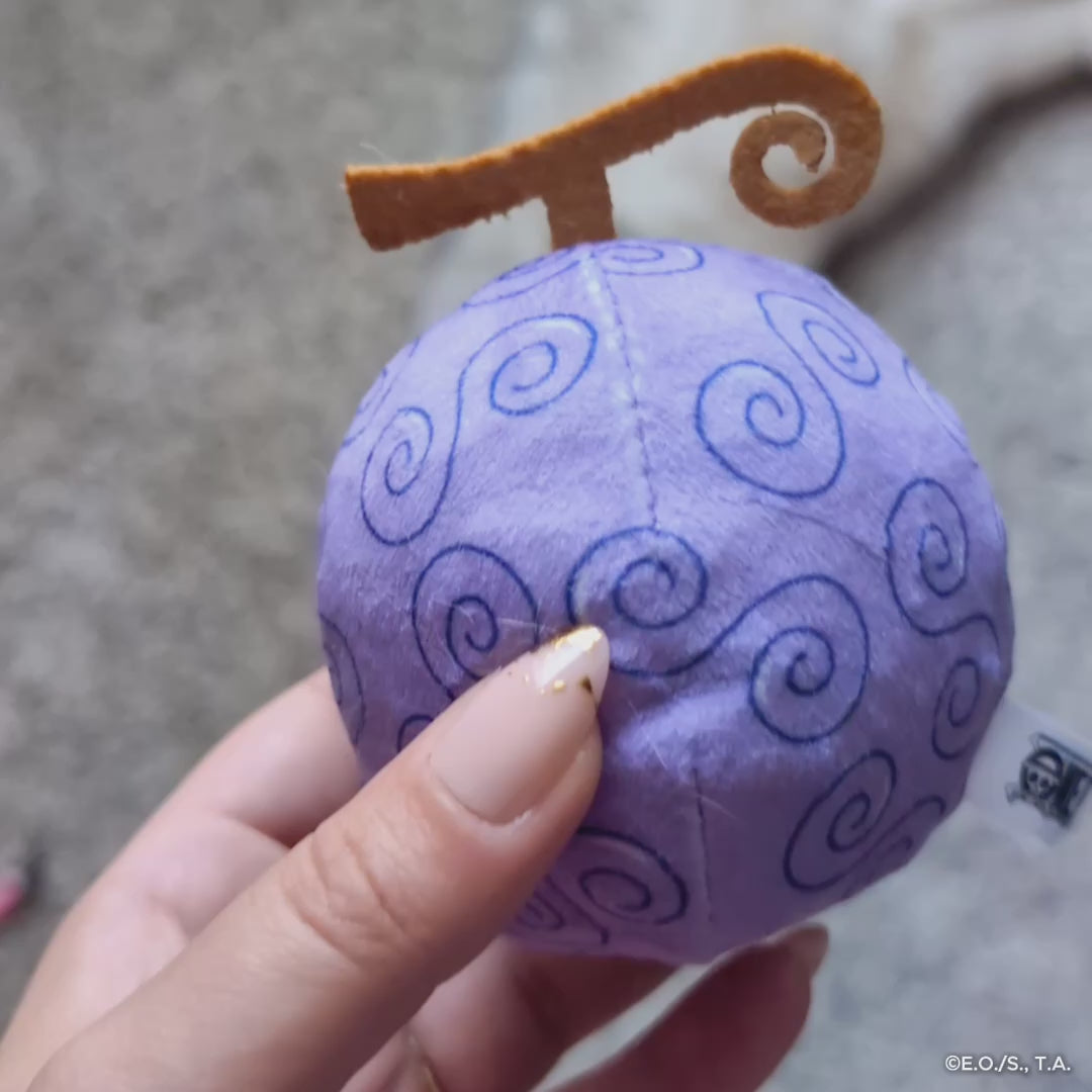 Video featuring One Piece Gum-Gum Fruit Cat Toy, featuring close-up shots of the purple plush design, crinkle sounds, and a cat playing energetically with the toy.