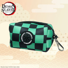 Green and black checkered Demon Slayer Tanjiro Kamado poop bag dispenser with the Pawsonify logo and a black clip by Pawsonify