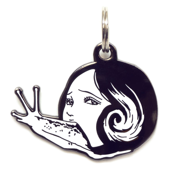 A pet tag featuring Slug Girl, a grotesque character from Junji Ito's manga, with her eerie appearance and slimy body.